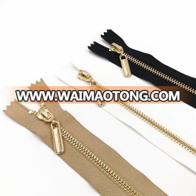 HIGHLY POLISHED SMOOTH RUNNING SHINY GOLDEN METAL ZIP